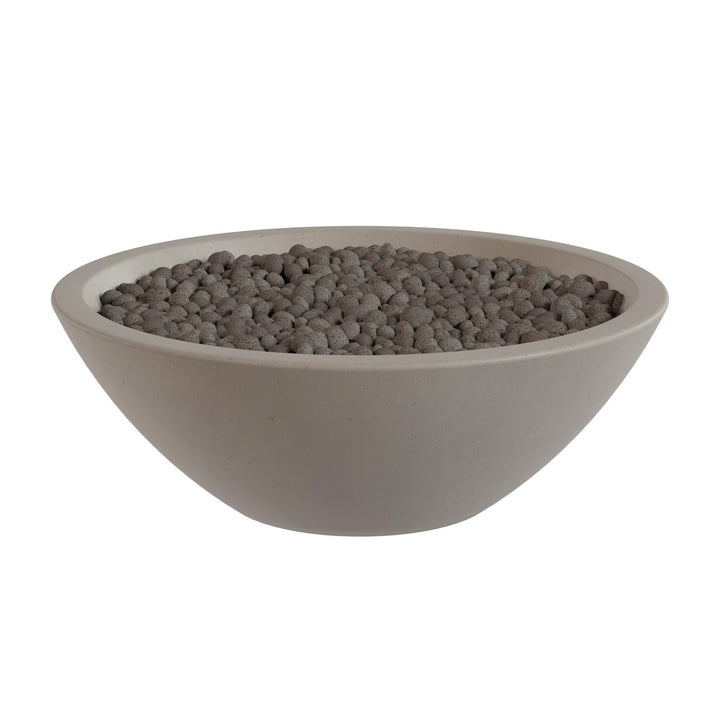 A white bowl filled with small, round objects, possibly stones or pebbles.