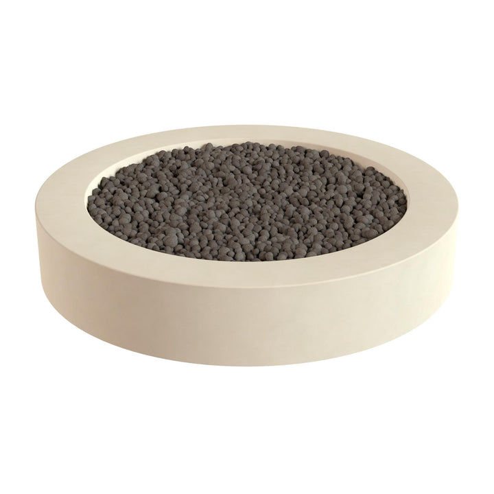 A white, circular planter filled with dark-colored pebbles or stones.