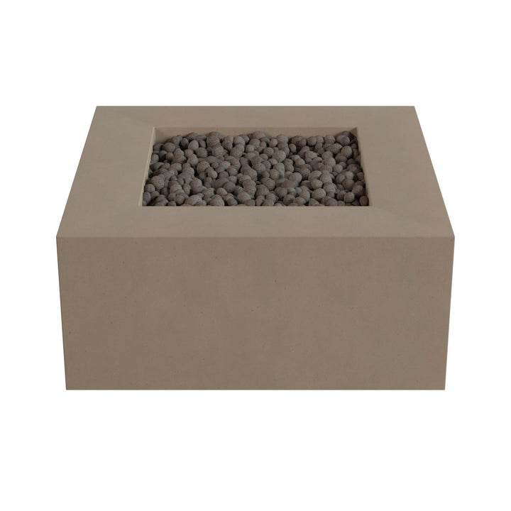 A rectangular concrete planter filled with small gray stones or pebbles.
