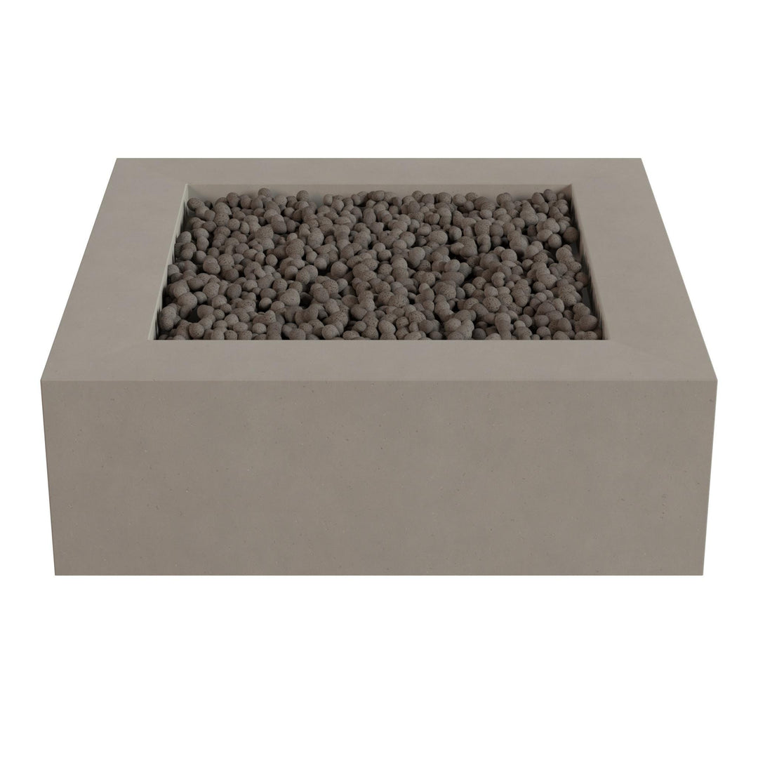A rectangular concrete planter filled with small gray stones or pebbles.