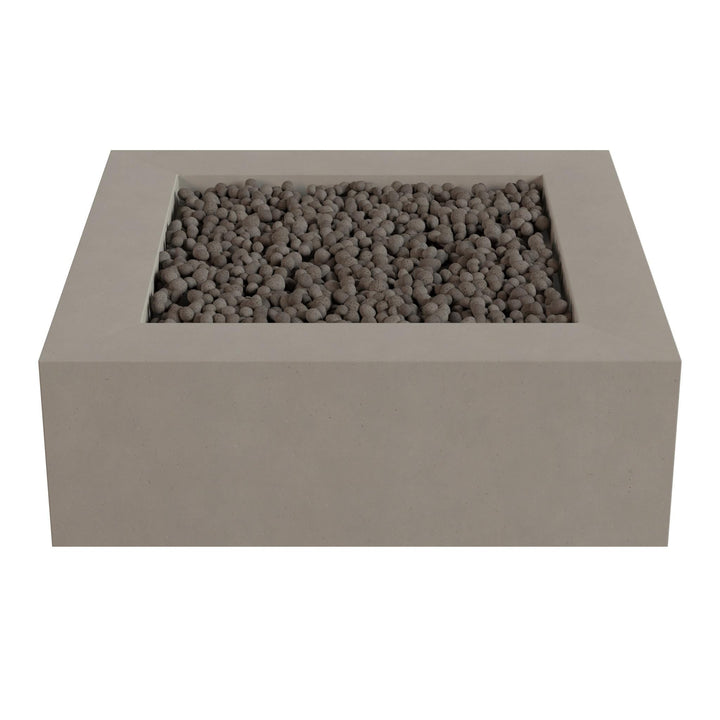 A rectangular concrete planter filled with small gray stones or pebbles.