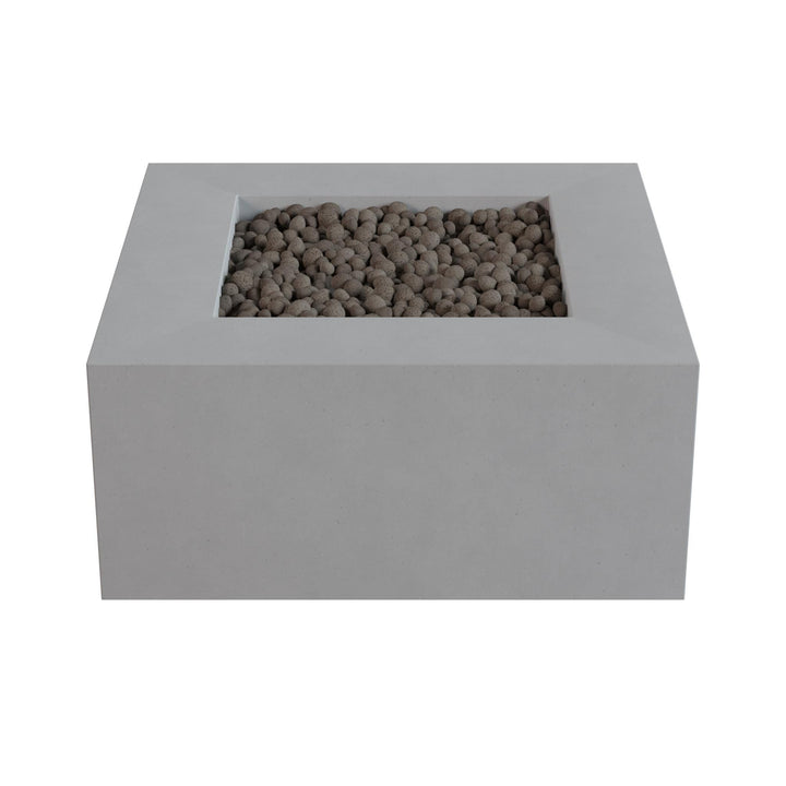 a rectangular concrete planter box filled with small rocks or pebbles.