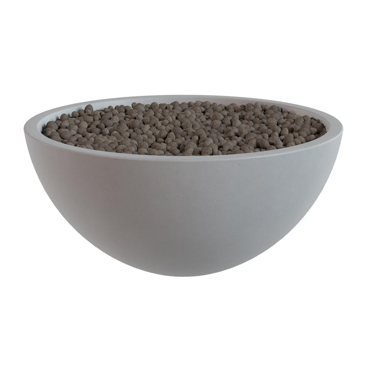 A white bowl filled with small, round objects, possibly beads or stones, is shown against a white background.