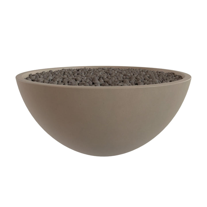 A large, round bowl filled with small, dark-colored stones or pebbles.