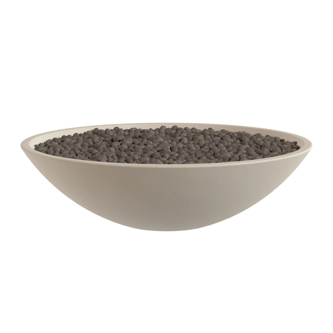 A white bowl filled with small, dark-colored objects, possibly gravel or pebbles.