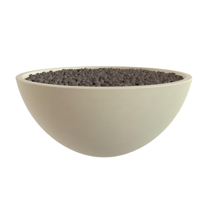 A white bowl filled with small, dark-colored objects, possibly stones or pebbles.