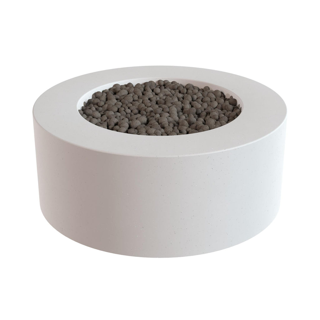 a white, circular planter filled with small, dark-colored stones or pebbles.