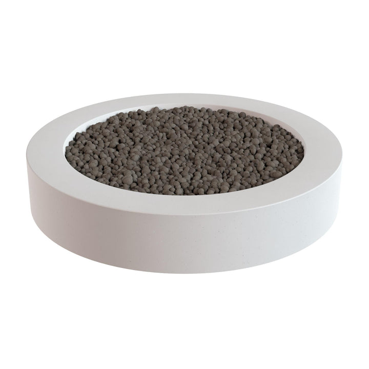 a white circular container filled with small, dark-colored stones or pebbles.