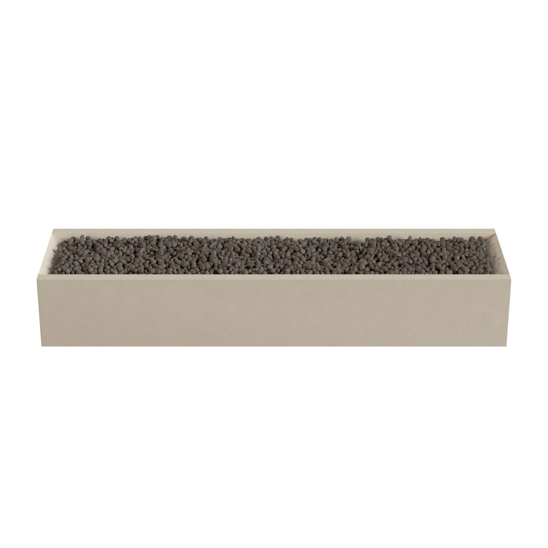 A rectangular planter box filled with small rocks or pebbles.