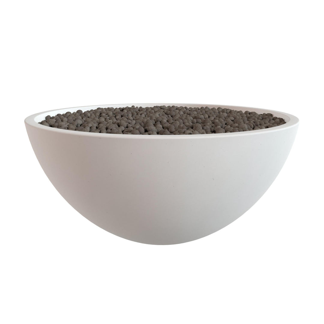 A white bowl filled with small, dark-colored objects, possibly gravel or pebbles.
