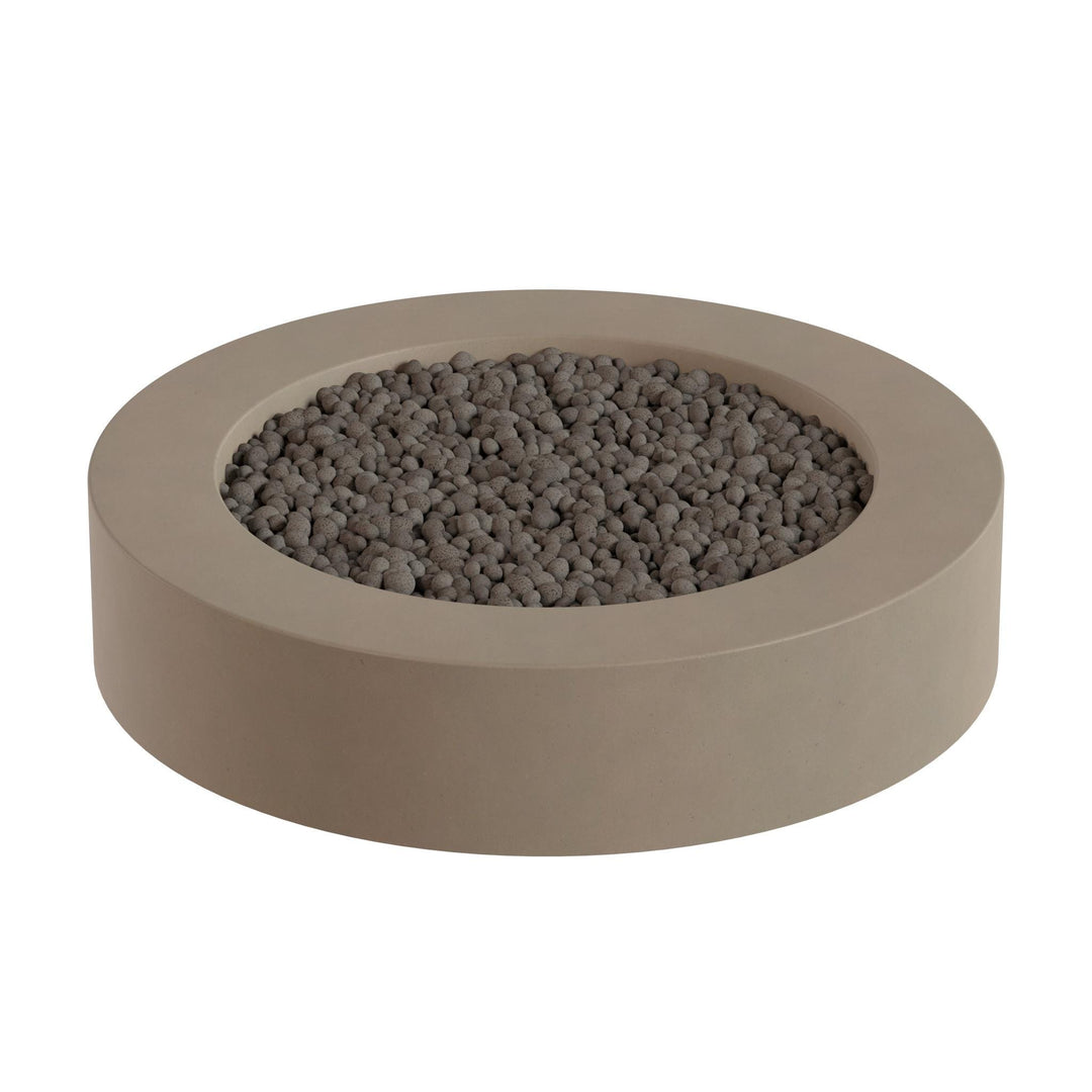 a round, beige-colored container filled with small, dark-colored stones or pebbles.