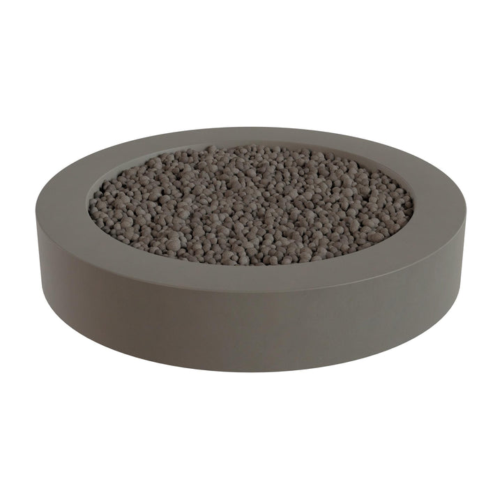 a gray, circular planter filled with small rocks or pebbles.