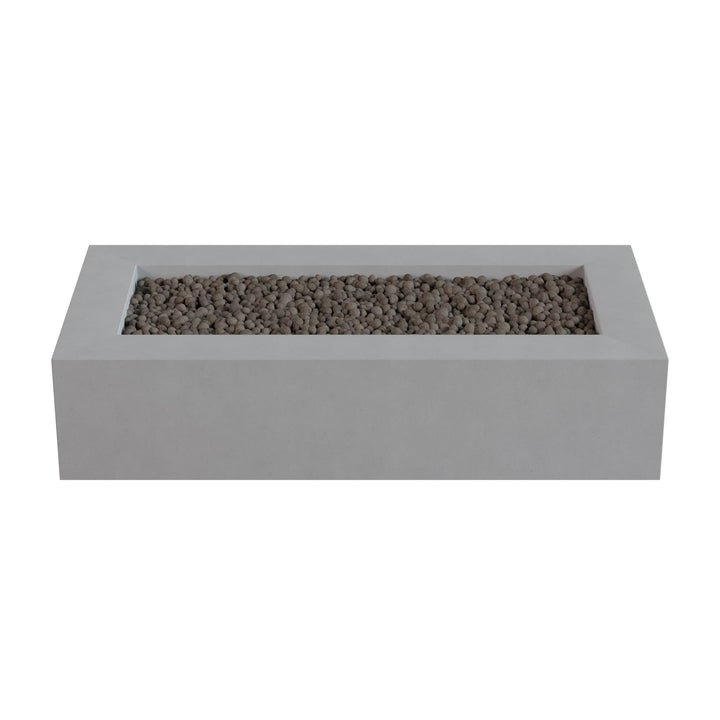 A rectangular concrete planter filled with small rocks or pebbles.