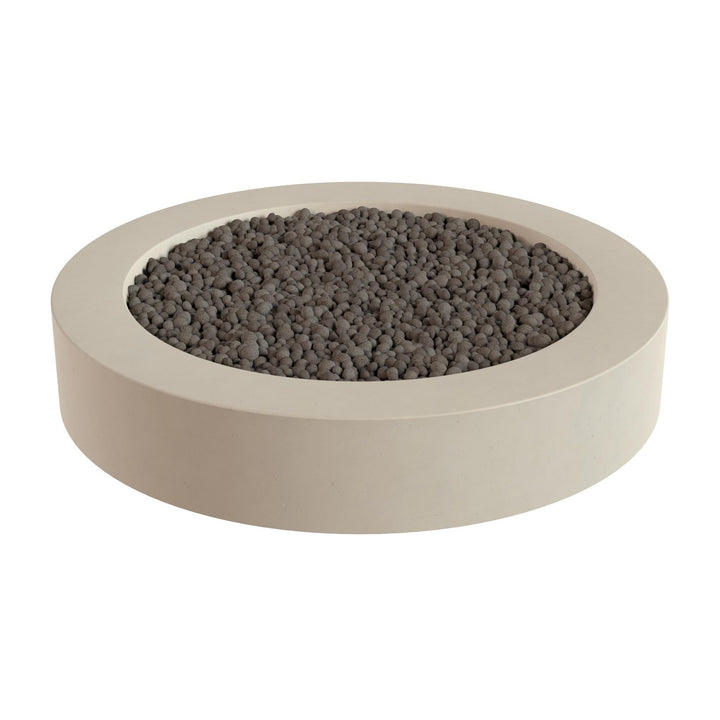 a round, beige-colored container filled with small, dark-colored stones or pebbles.