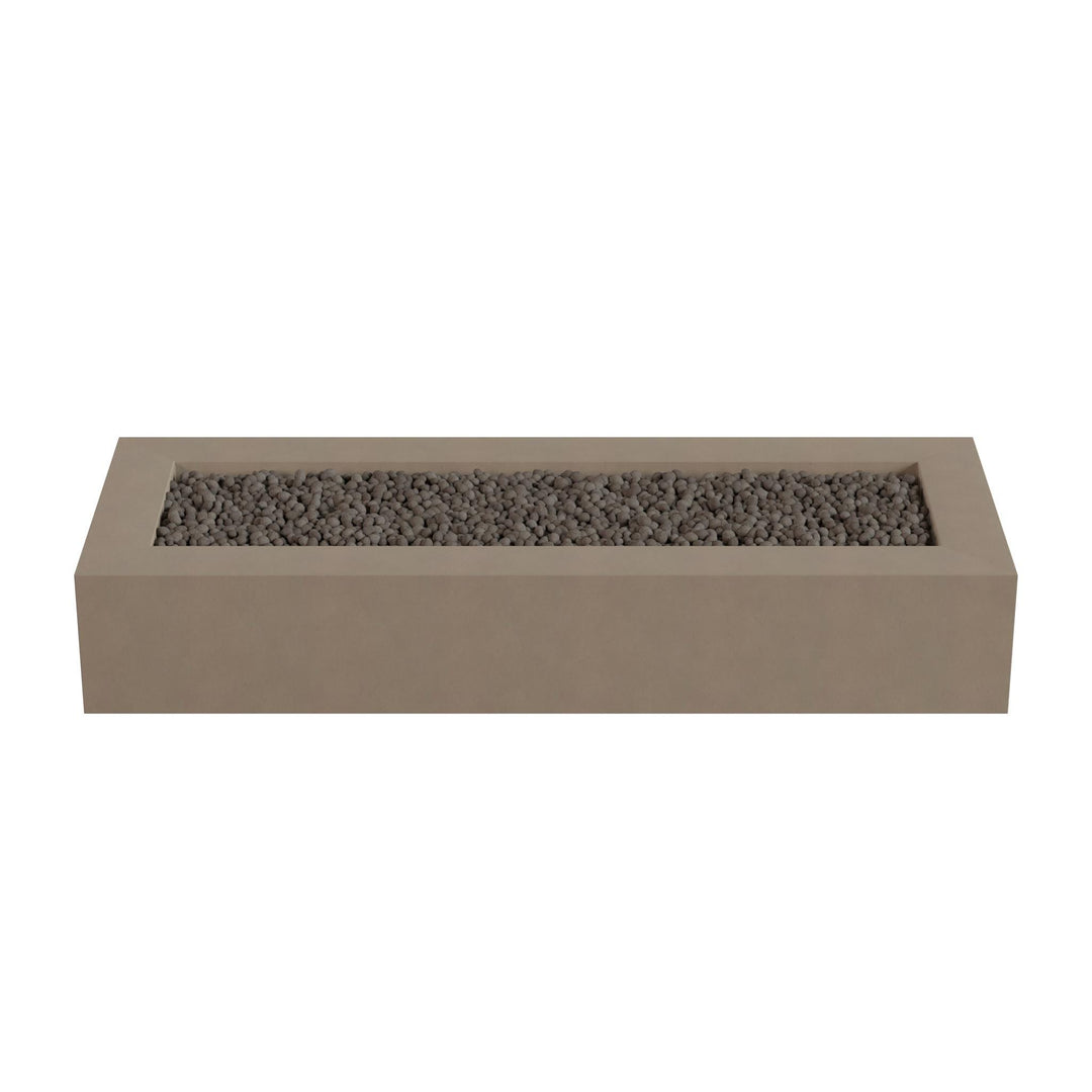 A rectangular concrete planter box filled with small rocks or pebbles.
