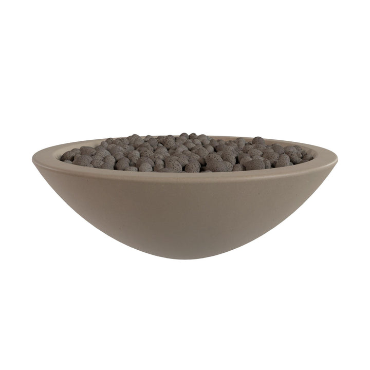 A large, round bowl filled with small, dark-colored stones or pebbles.
