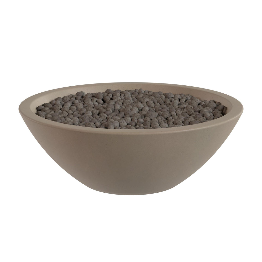 A large, round bowl filled with small, dark-colored stones or pebbles.