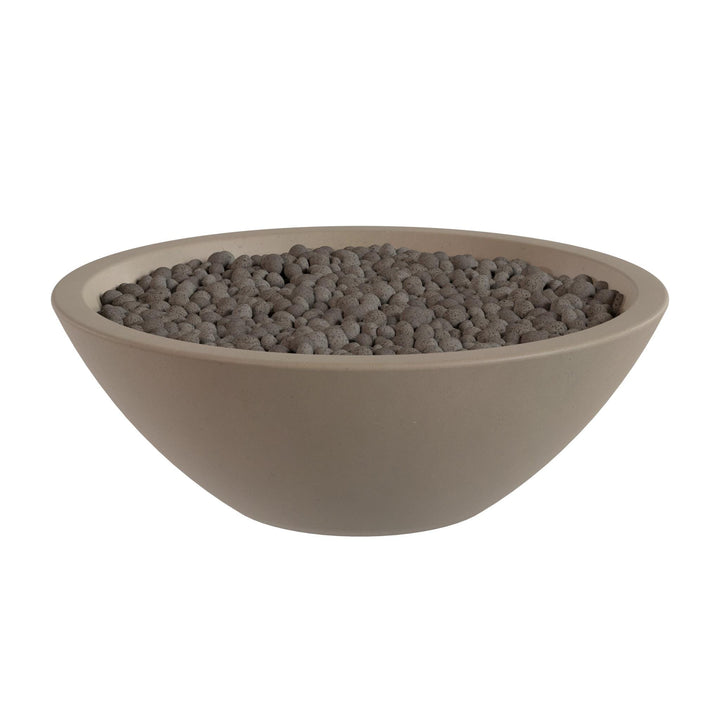 A large, round bowl filled with small, dark-colored stones or pebbles.