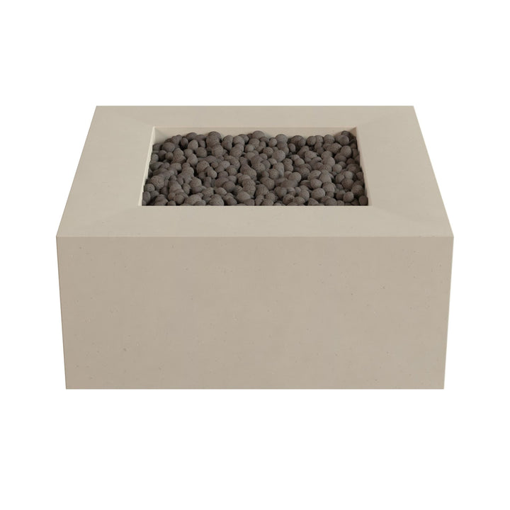 A rectangular concrete planter box filled with small gray stones or pebbles.