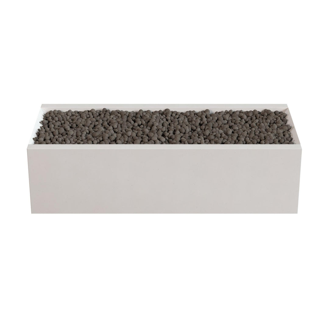 A rectangular planter box filled with small rocks or pebbles.
