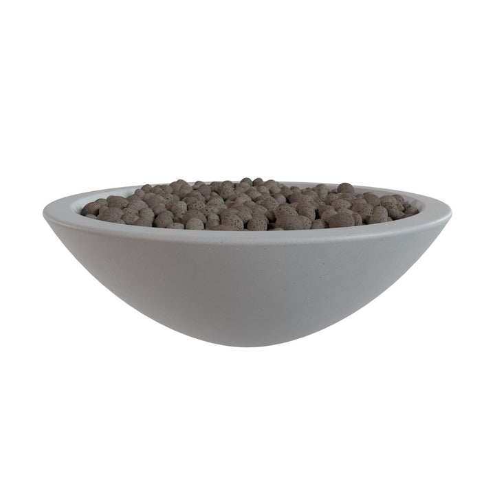A white bowl filled with small, round objects, possibly stones or pebbles, is shown against a white background.