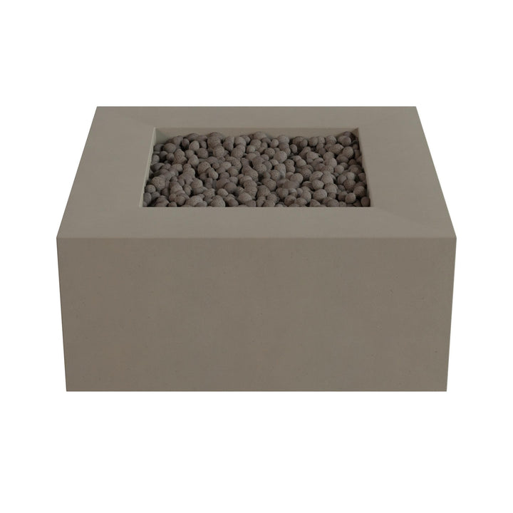 A rectangular concrete planter filled with small rocks or pebbles.