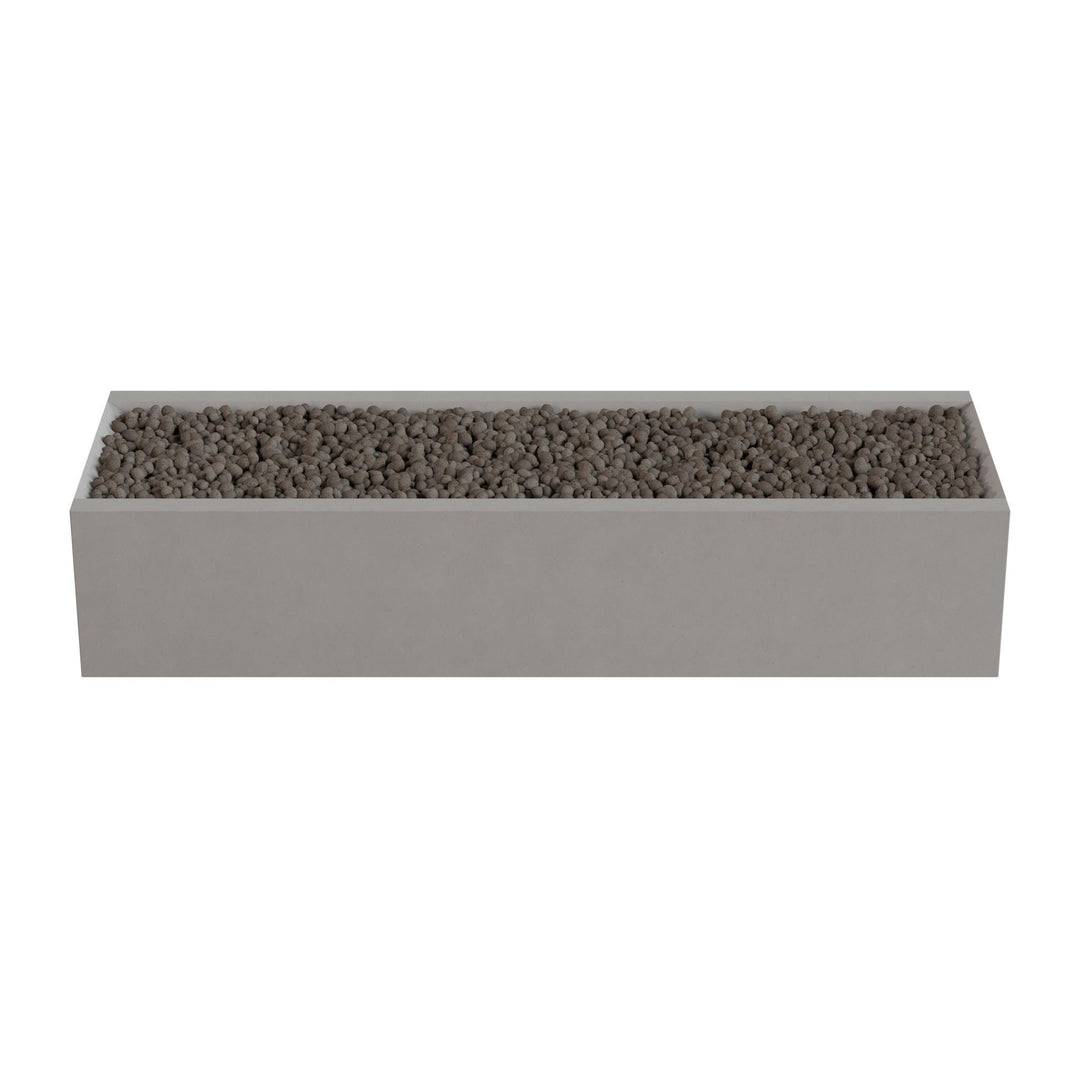 A rectangular planter box filled with small rocks or pebbles.
