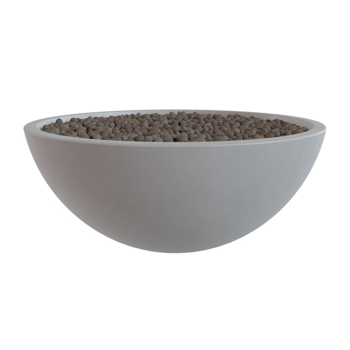 A white bowl filled with small, round objects, likely pebbles or stones, is shown against a white background.