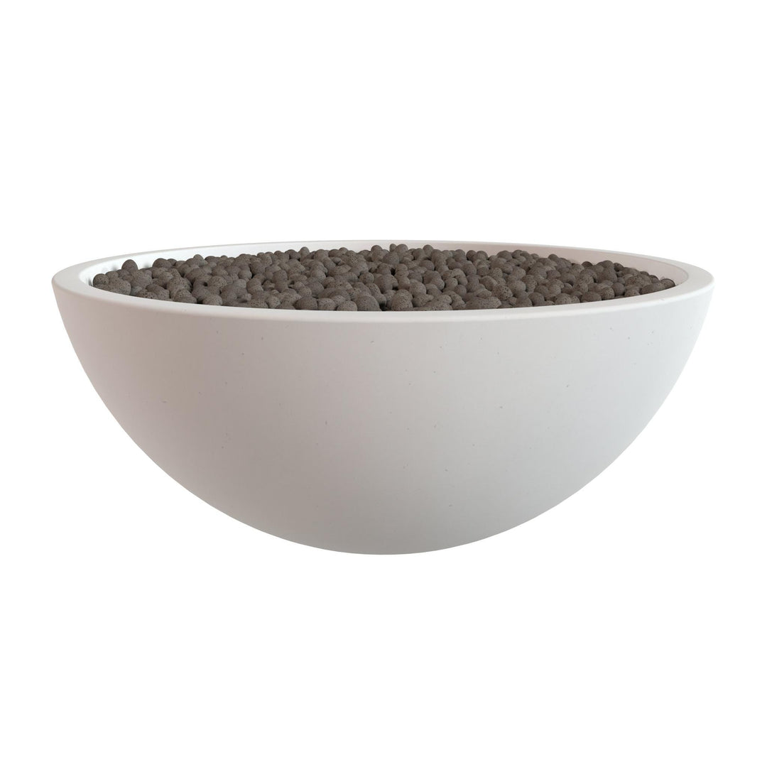 A white bowl filled with small, dark-colored objects, possibly stones or pebbles.