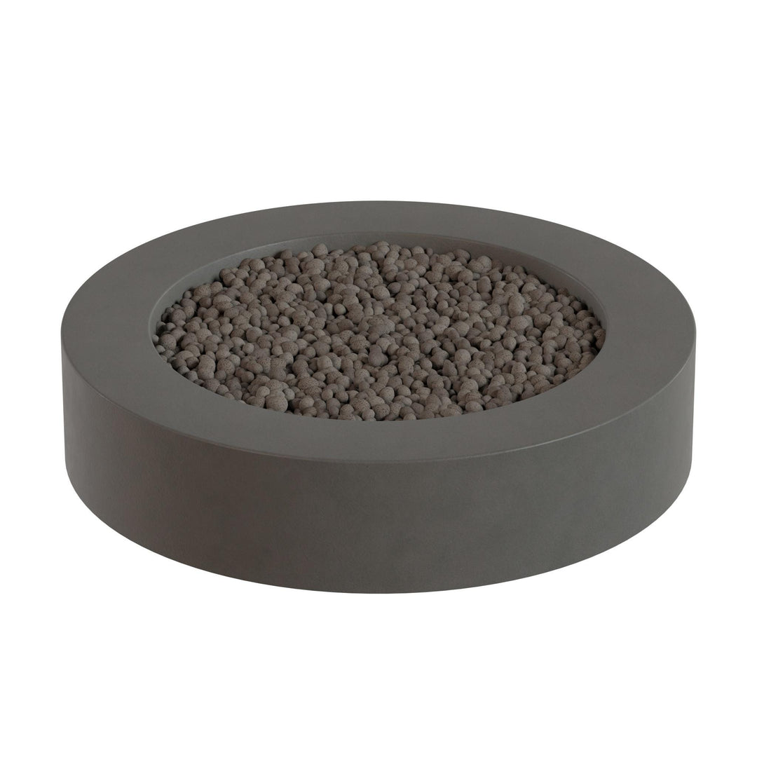 a gray, circular planter filled with small, round stones or pebbles.