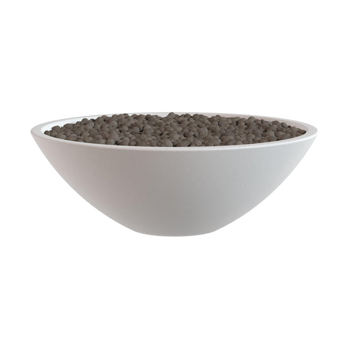 A white bowl filled with small, dark-colored objects, possibly pebbles or stones.