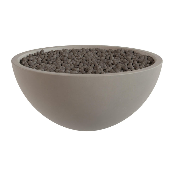 A large, round bowl filled with small, dark-colored stones or pebbles.