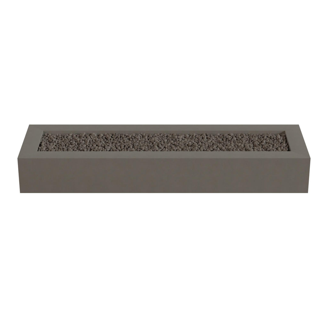 A rectangular gray planter box filled with small rocks or pebbles.