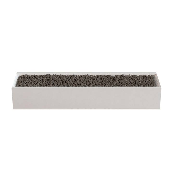A rectangular white planter box filled with small dark-colored stones or pebbles.