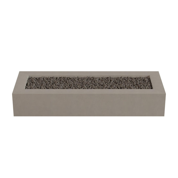A rectangular concrete planter filled with small rocks or pebbles.