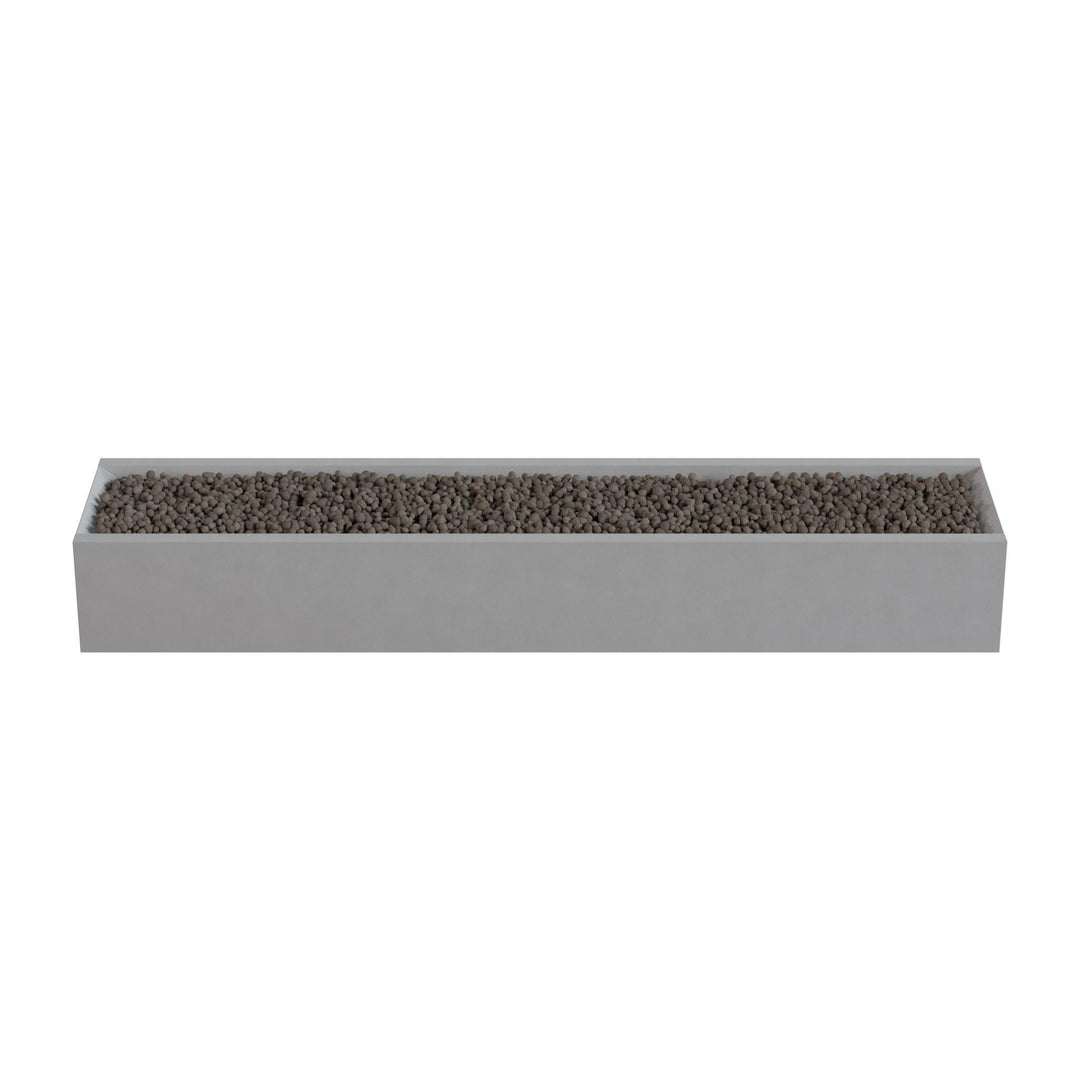 A rectangular planter box filled with small rocks or pebbles.