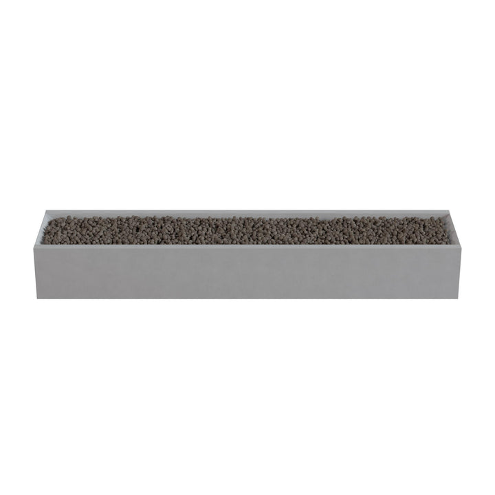 A rectangular planter box filled with small rocks or pebbles.