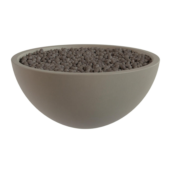 A large, round bowl filled with small, dark-colored stones or pebbles.