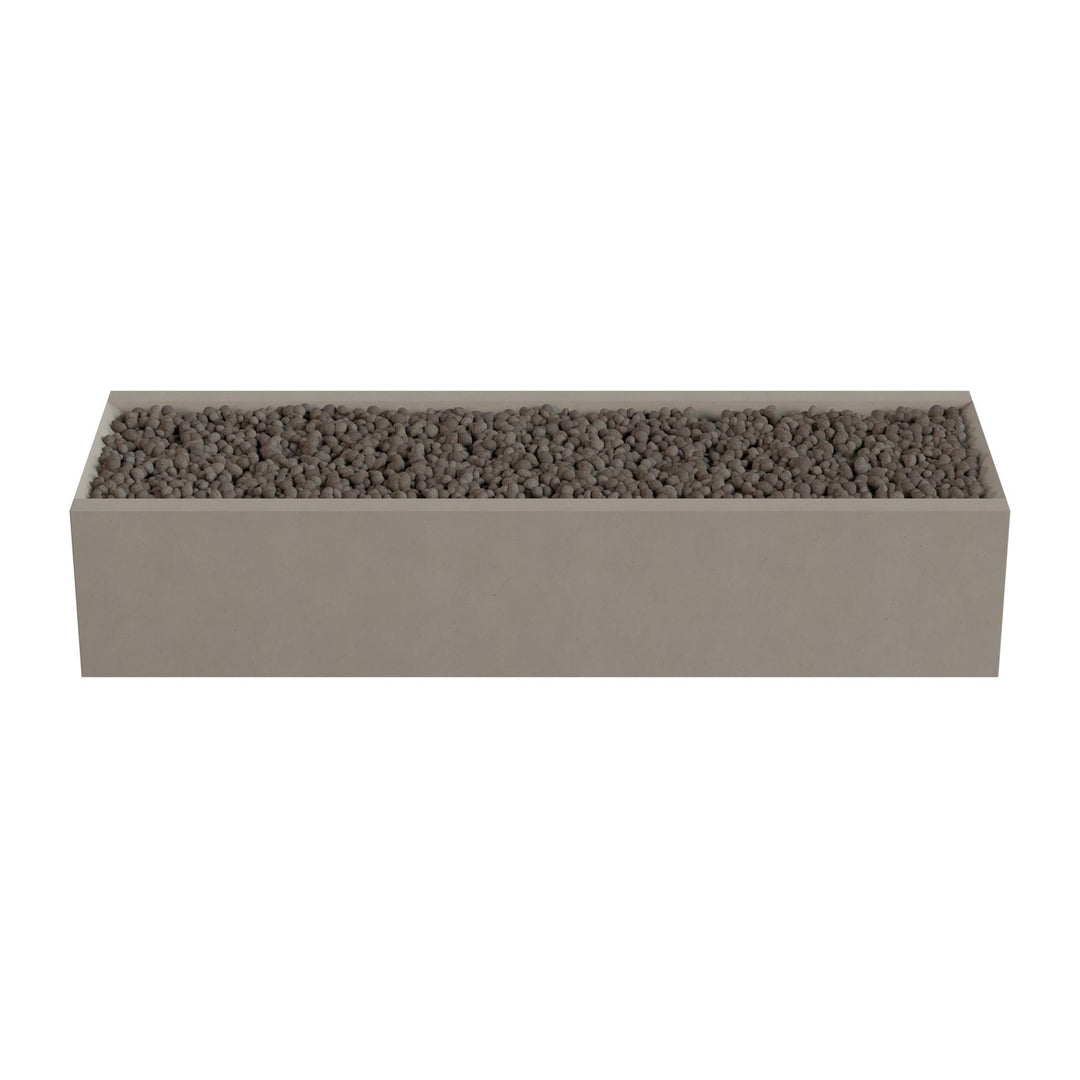 A rectangular planter box filled with small rocks or pebbles.
