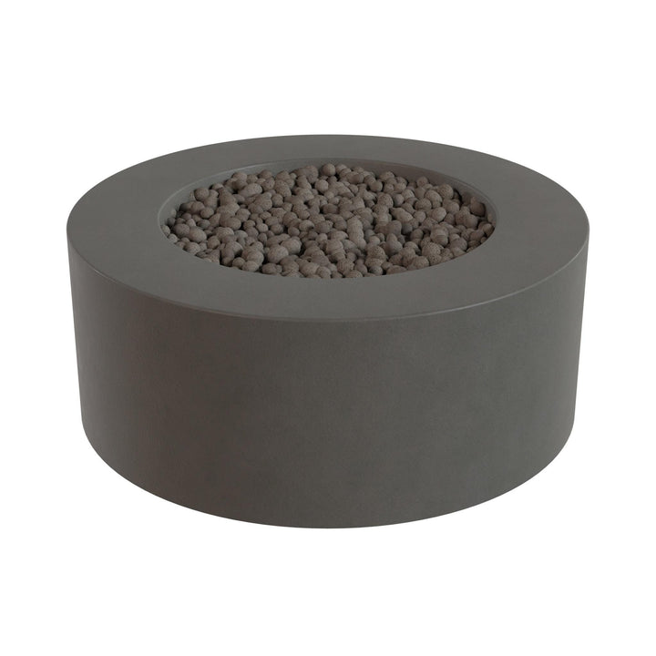 a gray, circular fire pit or planter filled with small rocks or pebbles.