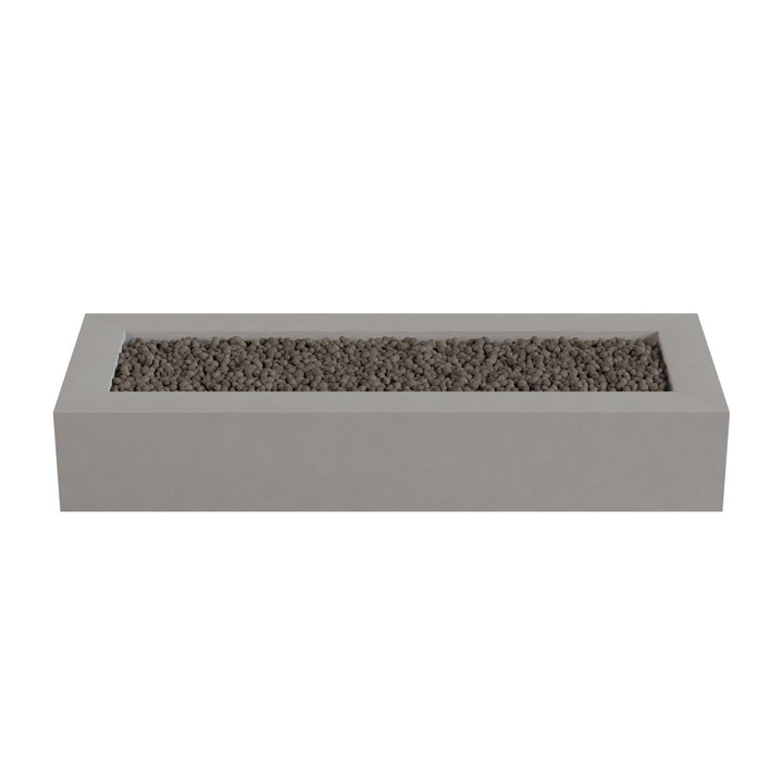 A rectangular concrete planter filled with small rocks or pebbles.