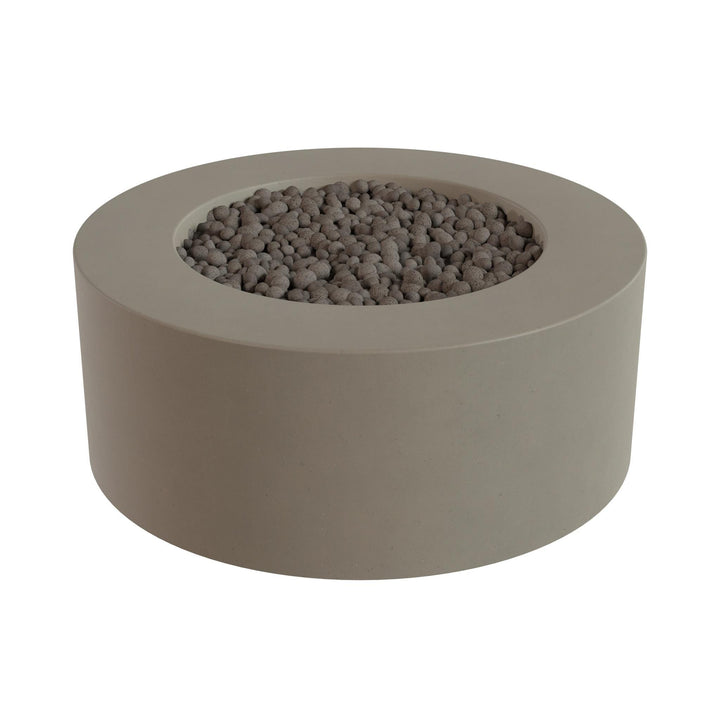 a round, gray stone or concrete structure with a hole in the center, filled with small gray stones or pebbles.
