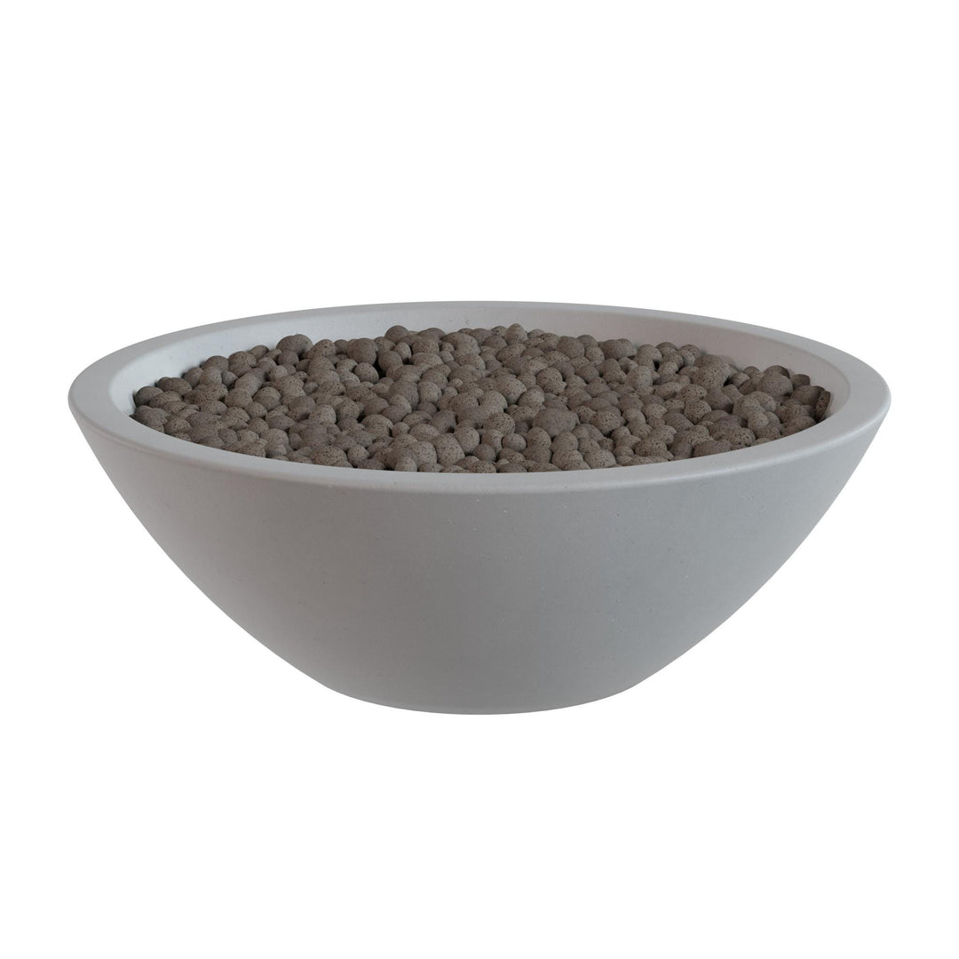 A white bowl filled with small, round objects, possibly beads or grains, is shown against a white background.