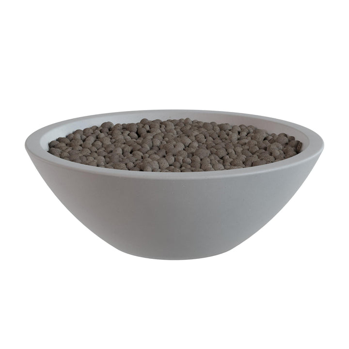 A white bowl filled with small, round objects, possibly beads or grains, is shown against a white background.