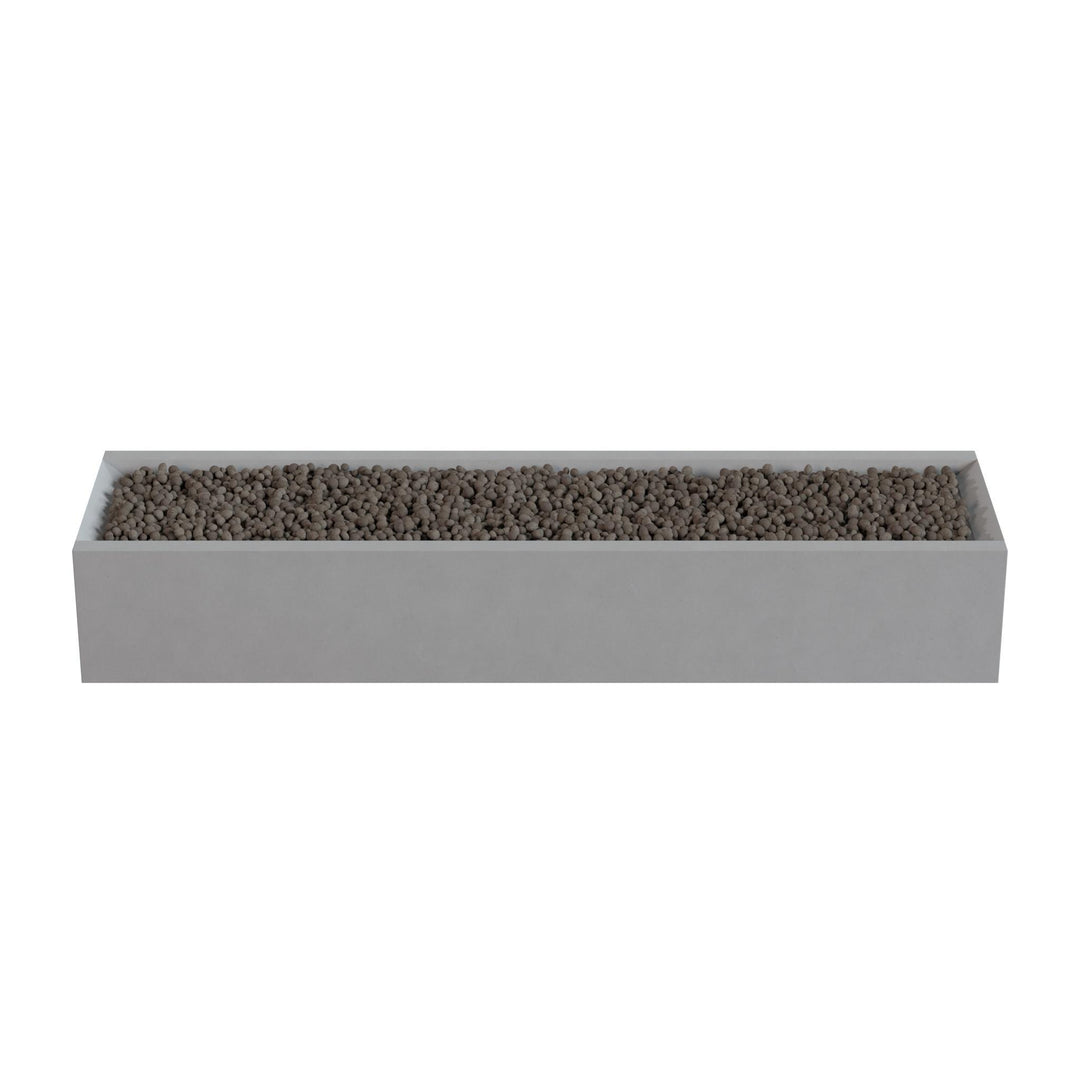 A rectangular planter box filled with small rocks or pebbles.
