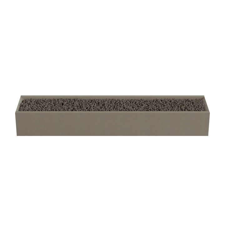 A rectangular planter box filled with small rocks or pebbles.