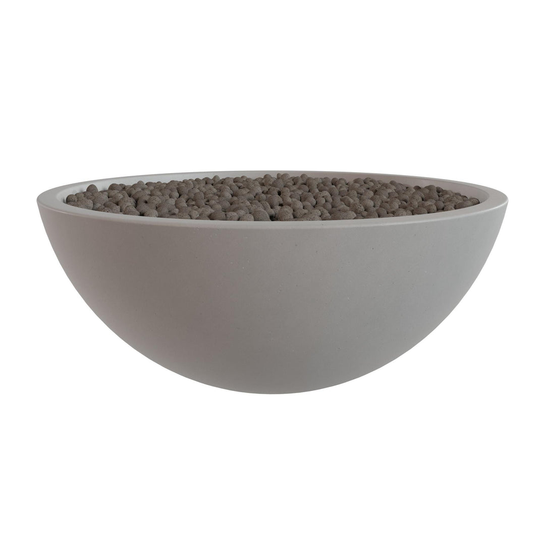 A white bowl filled with small gray stones or pebbles.