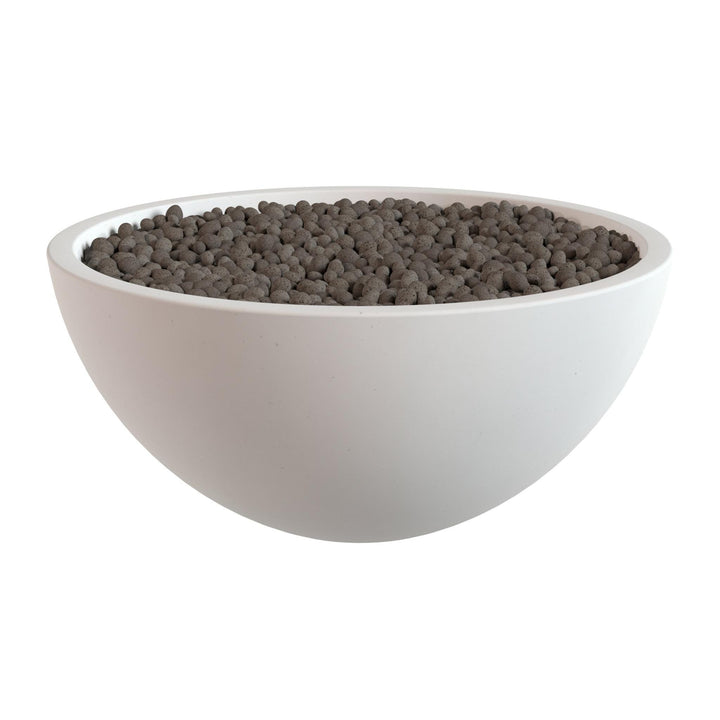 A white bowl filled with dark brown or black spherical objects, possibly nuts or seeds.