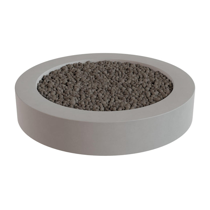 a round, gray planter filled with small rocks or pebbles.
