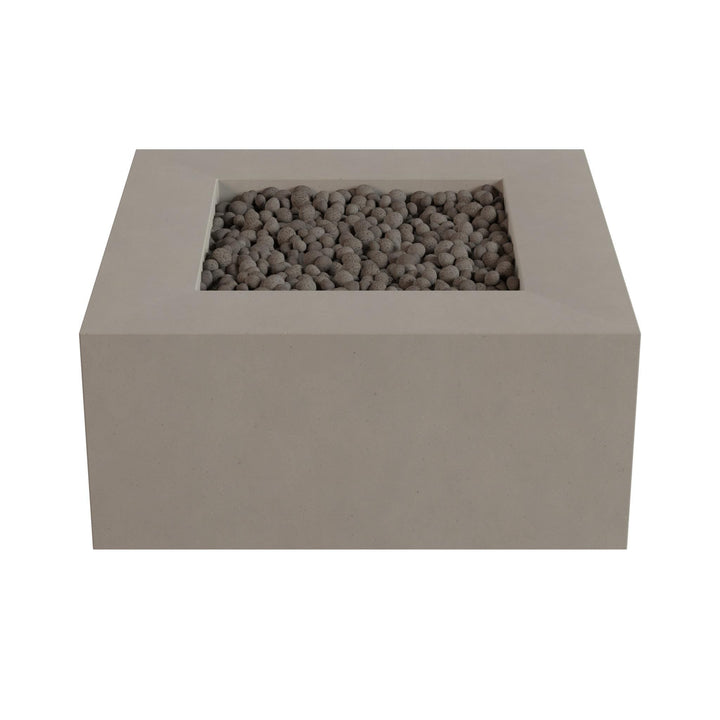 A rectangular concrete planter filled with small rocks or pebbles.